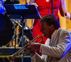A picture of Michael Roberts playing Trumpet on stage